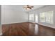 Bright living room with hardwood floors, natural light and ceiling fan at 1505 Poets Glade Dr, Apex, NC 27523