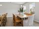 Dining room with large windows, table with decorative centerpiece, and natural light at 1520 Tamarisk Ln, Durham, NC 27703