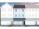 Charming townhome exterior with multiple windows, garage, and inviting curb appeal at 1520 Tamarisk Ln, Durham, NC 27703