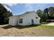 Back exterior view showcasing the home's clean lines, ample windows and yard at 172 W Old Rd, Lillington, NC 27546