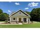 Charming home featuring a welcoming front porch, stone accents, and a well-manicured lawn at 172 W Old Rd, Lillington, NC 27546