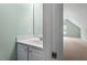 Bright bathroom with a clean white vanity and view to bonus room at 175 Georgetown Woods Dr, Youngsville, NC 27596