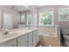 Bathroom with dual sinks, tub and large mirror at 175 Georgetown Woods Dr, Youngsville, NC 27596