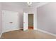 Bedroom showcasing a closet and an entrance to another room at 175 Georgetown Woods Dr, Youngsville, NC 27596