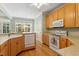 Bright eat-in kitchen with hardwood floors, granite counters, and stainless steel appliances at 175 Georgetown Woods Dr, Youngsville, NC 27596
