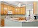 Well-lit kitchen features ample counter space, light cabinets, and modern appliances at 175 Georgetown Woods Dr, Youngsville, NC 27596