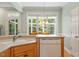 Eat-in kitchen features hardwood floors, light cabinetry, and lots of natural light at 175 Georgetown Woods Dr, Youngsville, NC 27596