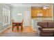 Bright kitchen features a breakfast nook with hardwood floors and a view of the backyard at 175 Georgetown Woods Dr, Youngsville, NC 27596