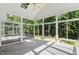 Bright sun room with vaulted ceiling and many windows overlooking the private backyard at 175 Georgetown Woods Dr, Youngsville, NC 27596