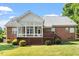 Screened-in porch and backyard, creating a serene retreat, with lush green surroundings at 175 Georgetown Woods Dr, Youngsville, NC 27596