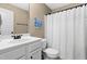 Bathroom featuring a single sink vanity, toilet, and white shower curtain at 20 Kola Nut, Smithfield, NC 27577