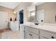 Bathroom featuring double sinks, a large mirror and a separate toilet area at 20 Kola Nut, Smithfield, NC 27577