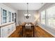 Dining area with hardwood floors, a wooden table, and a white hutch for storage at 20 Kola Nut, Smithfield, NC 27577