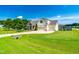 Spacious home with a large, manicured lawn, attached garage, and welcoming front porch at 20 Kola Nut, Smithfield, NC 27577