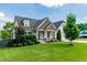 Charming single Gathering home with well-manicured lawn and mature trees on a sunny day at 20 Kola Nut, Smithfield, NC 27577