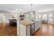 Open kitchen with a breakfast bar, stainless steel appliances, and views into the living room and dining area at 20 Kola Nut, Smithfield, NC 27577