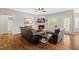 Cozy living room with fireplace, hardwood floors, and comfortable leather seating at 20 Kola Nut, Smithfield, NC 27577