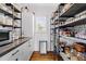 Well-organized pantry with custom shelving, storage cabinets, and modern trash receptacle at 20 Kola Nut, Smithfield, NC 27577
