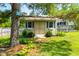 Charming storage shed with double doors, small windows, and landscaped surroundings at 20 Kola Nut, Smithfield, NC 27577
