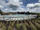 Large community pool with sun loungers and a clear view of nearby homes at 2118 Pink Peony Cir # 151, Durham, NC 27703