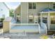 Charming backyard deck perfect for entertaining, with an adjacent brick patio and privacy at 212 Mickleson Ridge Dr, Raleigh, NC 27603
