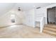 Upstairs empty room showcasing a dormer window, carpet, and a built in desk at 212 Mickleson Ridge Dr, Raleigh, NC 27603