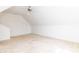 Upstairs bedroom showcasing a dormer window and neutral walls at 212 Mickleson Ridge Dr, Raleigh, NC 27603