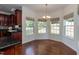 Bright breakfast nook with many windows offering natural light and backyard views at 212 Mickleson Ridge Dr, Raleigh, NC 27603