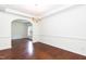Spacious dining room with classic details and arched entrance, ideal for entertaining at 212 Mickleson Ridge Dr, Raleigh, NC 27603