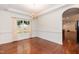 Dining room with hardwood floors, decorative molding, and arched doorway at 212 Mickleson Ridge Dr, Raleigh, NC 27603