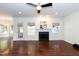 Bright, empty room with fireplace, windows, and ceiling fan offering ample space and natural light at 212 Mickleson Ridge Dr, Raleigh, NC 27603
