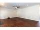 Spacious empty room with hardwood floors and a ceiling fan creating a blank canvas ready for your design ideas at 212 Mickleson Ridge Dr, Raleigh, NC 27603