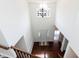 Entryway with staircase featuring hardwood floors and a chandelier at 212 Mickleson Ridge Dr, Raleigh, NC 27603
