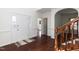 Welcoming entryway with hardwood floors and staircase at 212 Mickleson Ridge Dr, Raleigh, NC 27603