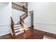 Elegant staircase with wood and white accents leading to the second floor at 212 Mickleson Ridge Dr, Raleigh, NC 27603
