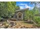Charming backyard with a fire pit and a wooden deck, perfect for outdoor entertaining and relaxation at 213 N Weststone Blvd, Fuquay Varina, NC 27526