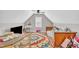 Attic bedroom with charming angles, natural light, and playful decor at 213 N Weststone Blvd, Fuquay Varina, NC 27526