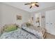 Charming bedroom with twin beds, a ceiling fan, and serene ambiance, perfect for rest at 213 N Weststone Blvd, Fuquay Varina, NC 27526
