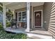 Inviting front porch with rocking chairs, perfect for relaxing and enjoying the outdoors at 213 N Weststone Blvd, Fuquay Varina, NC 27526
