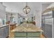 Open concept kitchen island with granite countertop, connecting to the dining and living areas at 213 N Weststone Blvd, Fuquay Varina, NC 27526