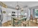 Bright kitchen featuring stainless steel appliances and a large island with seating at 213 N Weststone Blvd, Fuquay Varina, NC 27526