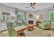 Bright living room with a fireplace, comfortable seating, and views to the outdoors at 213 N Weststone Blvd, Fuquay Varina, NC 27526