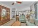 Open layout living room connecting to the kitchen, with comfortable furniture and hardwood floors at 213 N Weststone Blvd, Fuquay Varina, NC 27526