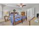 Main bedroom featuring a four-poster bed, ceiling fan, and neutral tones, offering comfort at 213 N Weststone Blvd, Fuquay Varina, NC 27526