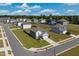 New homes in a neighborhood with green lawns and paved streets, offering a sense of community and modern living at 217 Windy Knoll Dr, Graham, NC 27253
