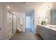 Bathroom featuring a glass-enclosed shower and a vanity with modern fixtures and a large mirror at 217 Windy Knoll Dr, Graham, NC 27253