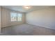 Bedroom showcasing a large window for ample natural light, neutral carpet and paint for a modern look at 217 Windy Knoll Dr, Graham, NC 27253