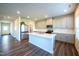 Modern kitchen featuring stainless steel appliances, a large island, and sleek gray cabinets for a contemporary feel at 217 Windy Knoll Dr, Graham, NC 27253