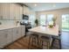 Bright, modern kitchen with a large island, stainless steel appliances, and stylish bar stools, perfect for entertaining guests at 217 Windy Knoll Dr, Graham, NC 27253