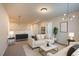 Cozy loft with stylish furnishings, soft carpet, and modern lighting fixtures creating a relaxing atmosphere at 217 Windy Knoll Dr, Graham, NC 27253